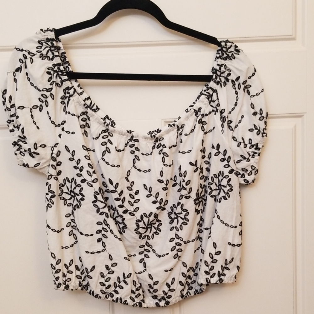 Pretty white top with black embroidered eyelets